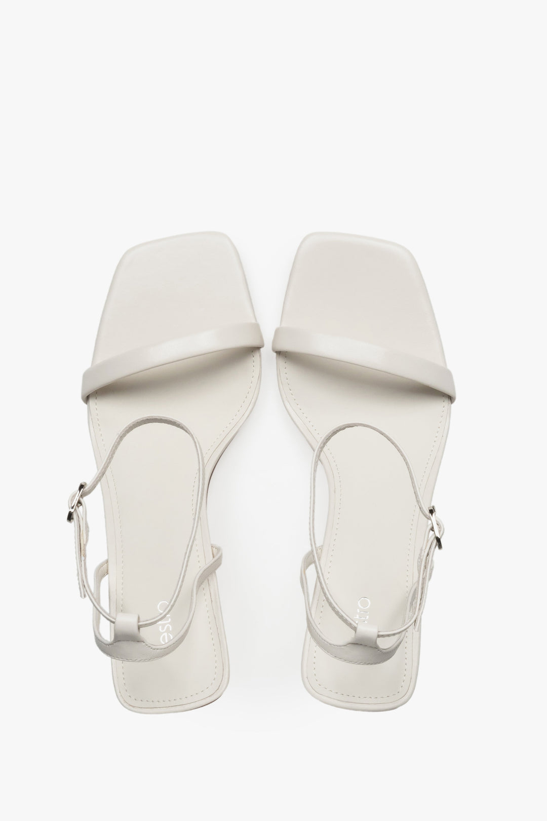 Top view of women's beige leather funnel heel sandals by Estro.