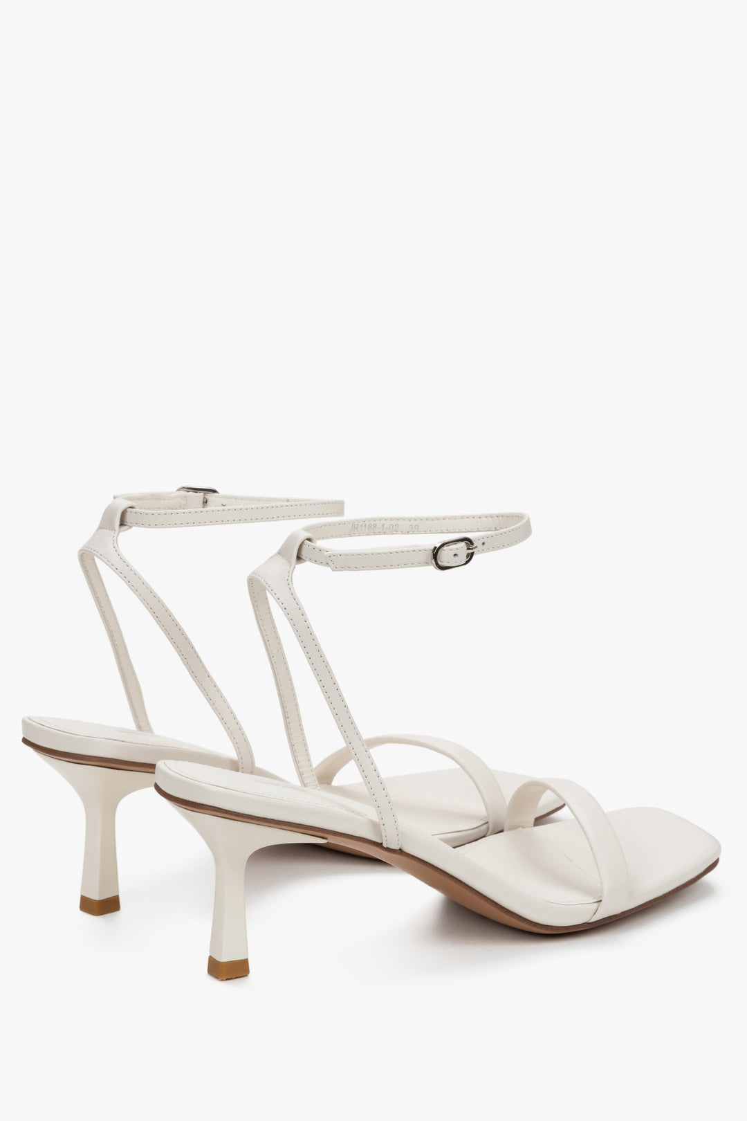 Detail view of silver details on women's beige Estro sandals.