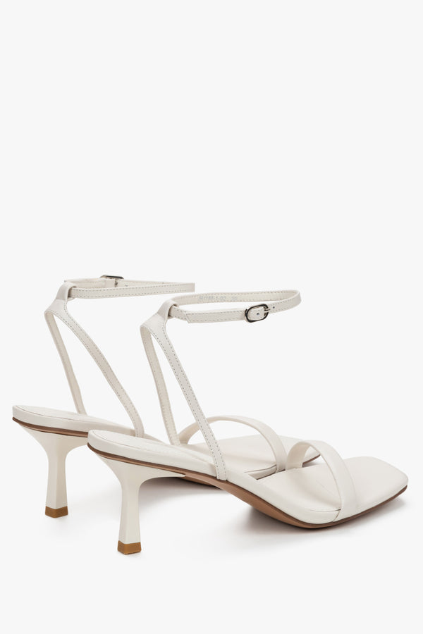 Detail view of silver details on women's beige Estro sandals.
