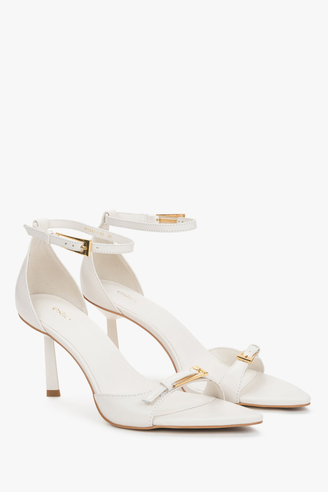 Women's beige leather stiletto sandals by Estro with decorative buckles.