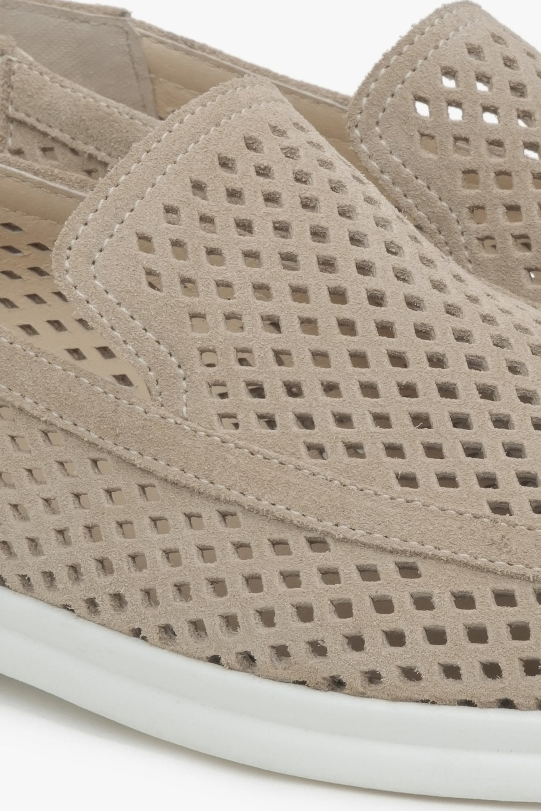 Beige women's moccasins with perforation made of Premium Italian velour – details.