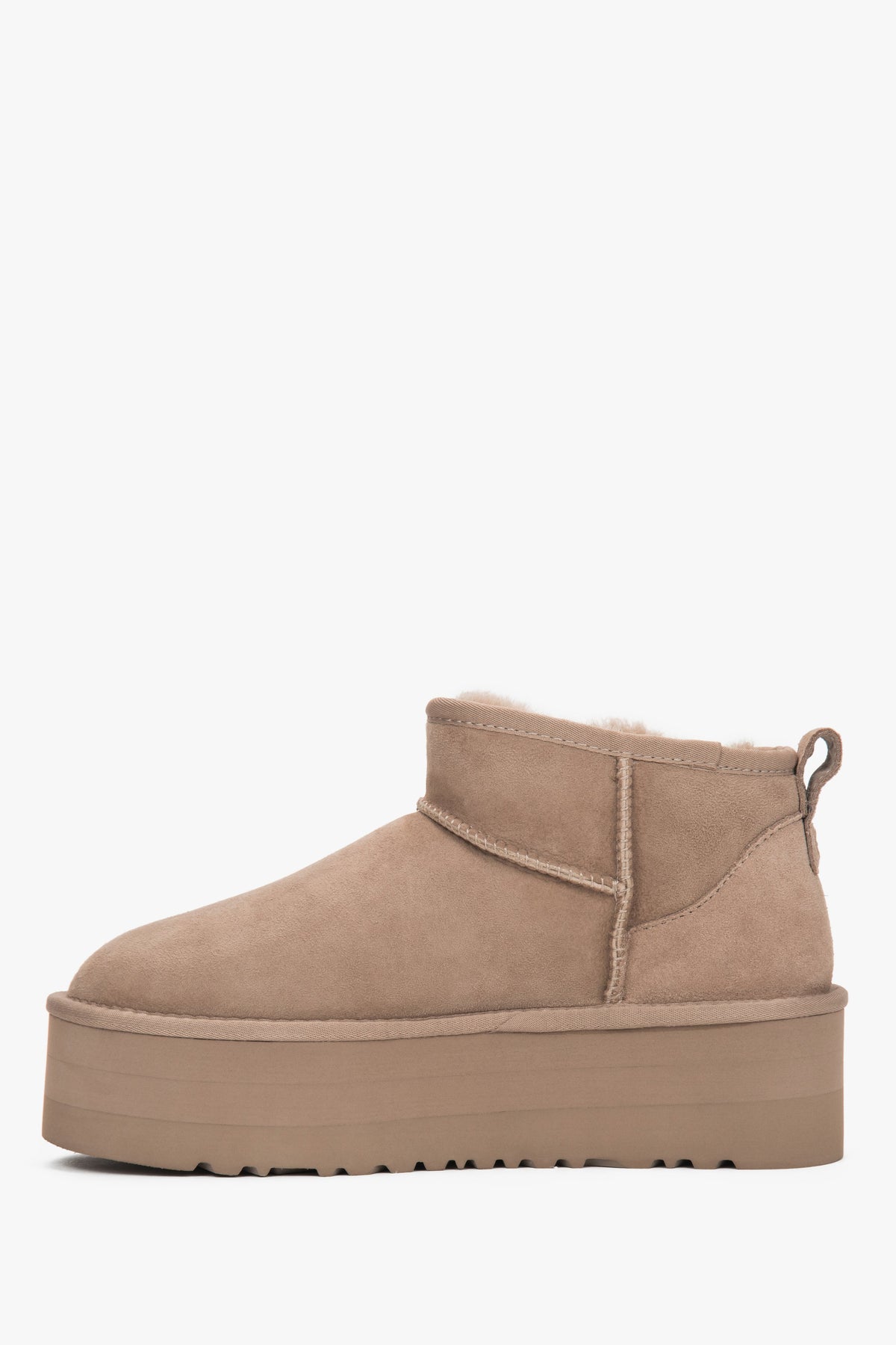 Made of genuine velour, beige women’s platform snow boots with a fur lining by Estro.