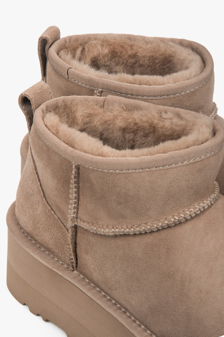 Beige women’s platform snow boots made of genuine velour with a fur lining.