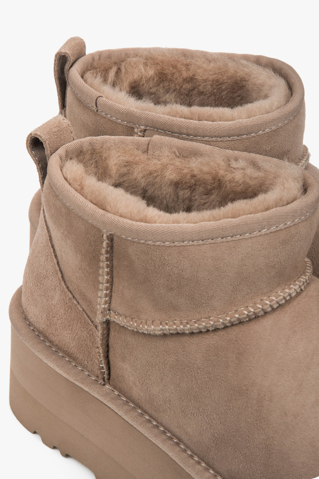 Beige women’s platform snow boots made of genuine velour with a fur lining.