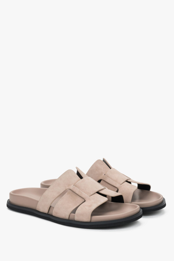 Beige women’s velour slide sandals.