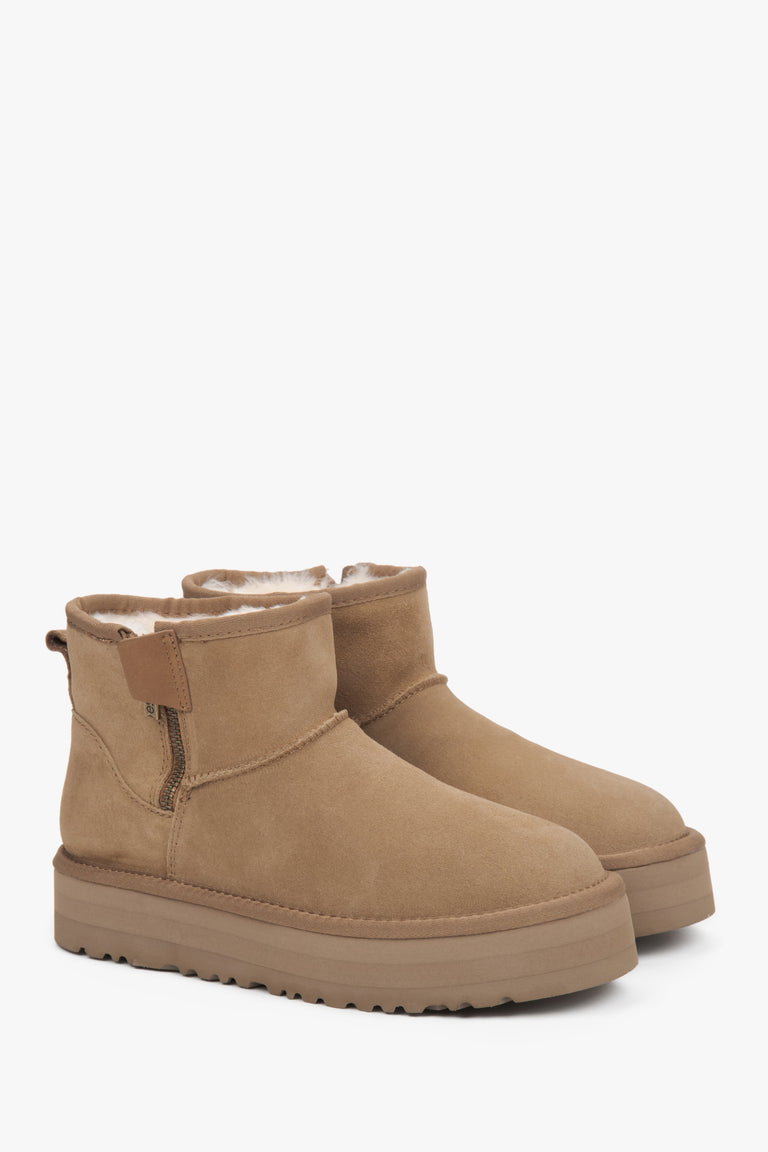 Women's snow boots made of genuine velour, lined with fur, in beige.