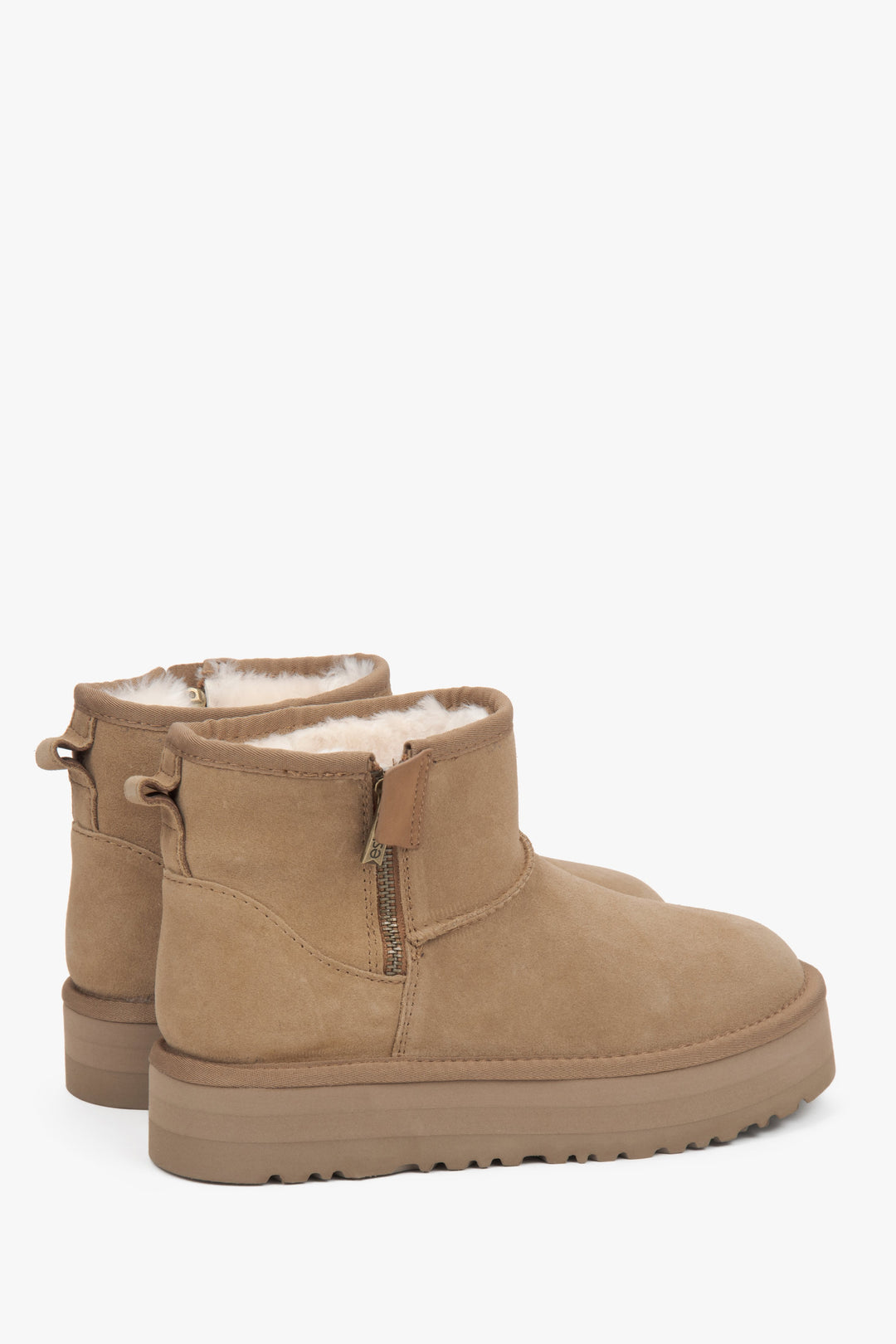 Beige women's velour snow boots with fur.