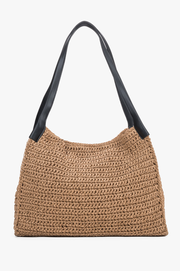 Side view of women's beige straw shopper bag by Estro