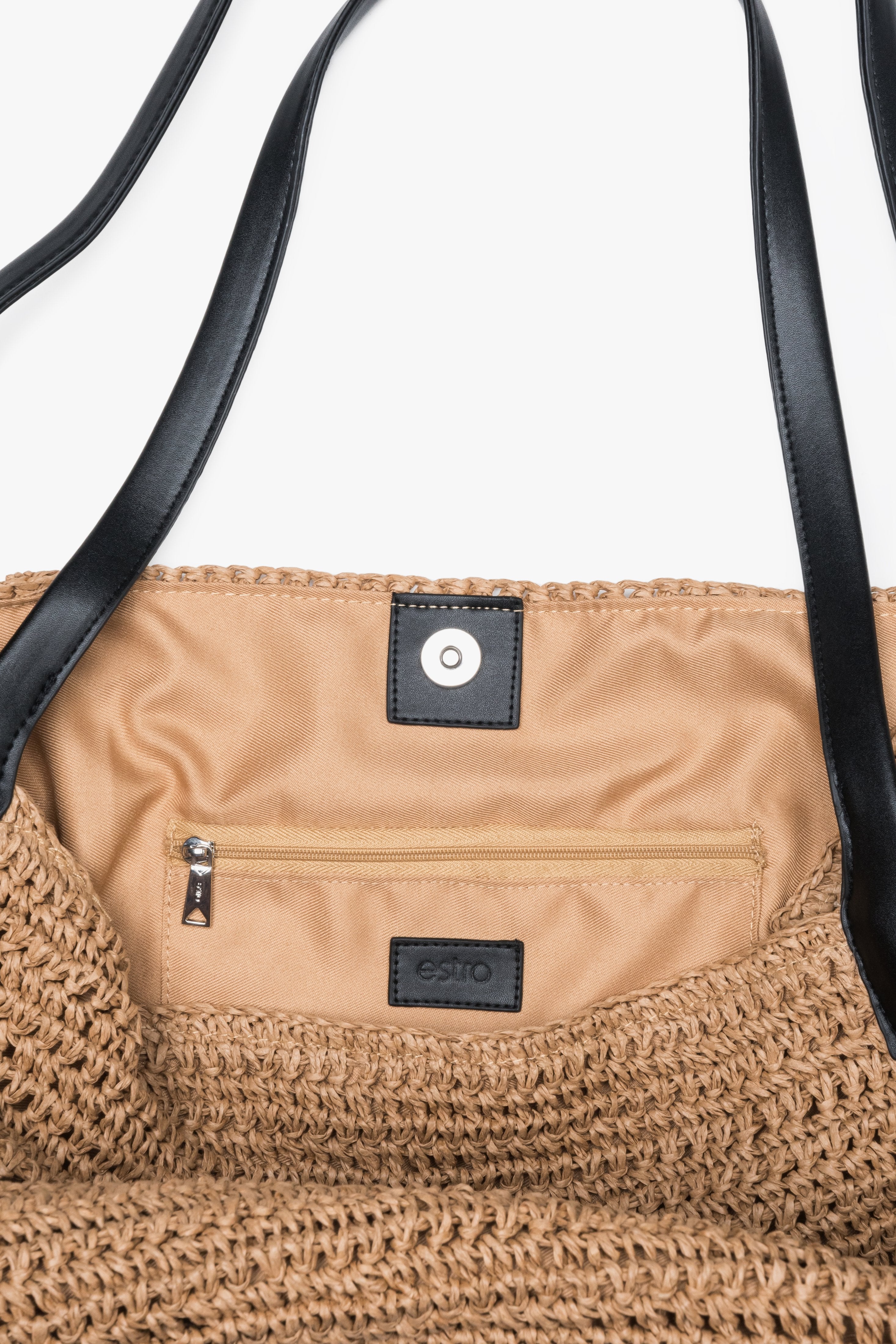 Interior detail of women's beige straw shopper bag by Estro