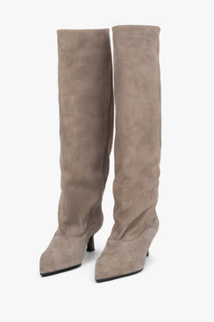 Women's beige knee-high boots made of genuine velour with a low flared heel by Estro.