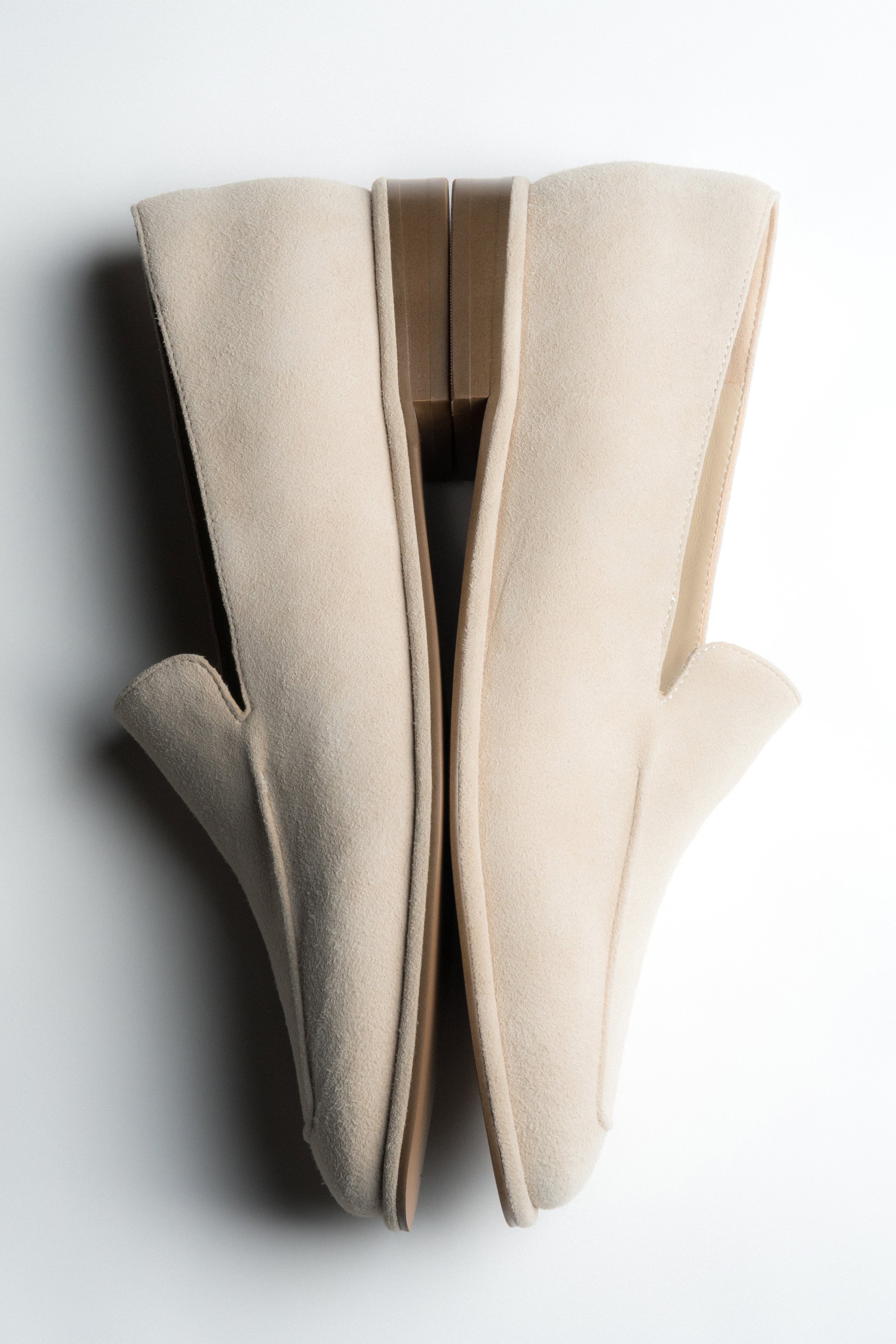 Side detail of women's beige velour loafers by Estro