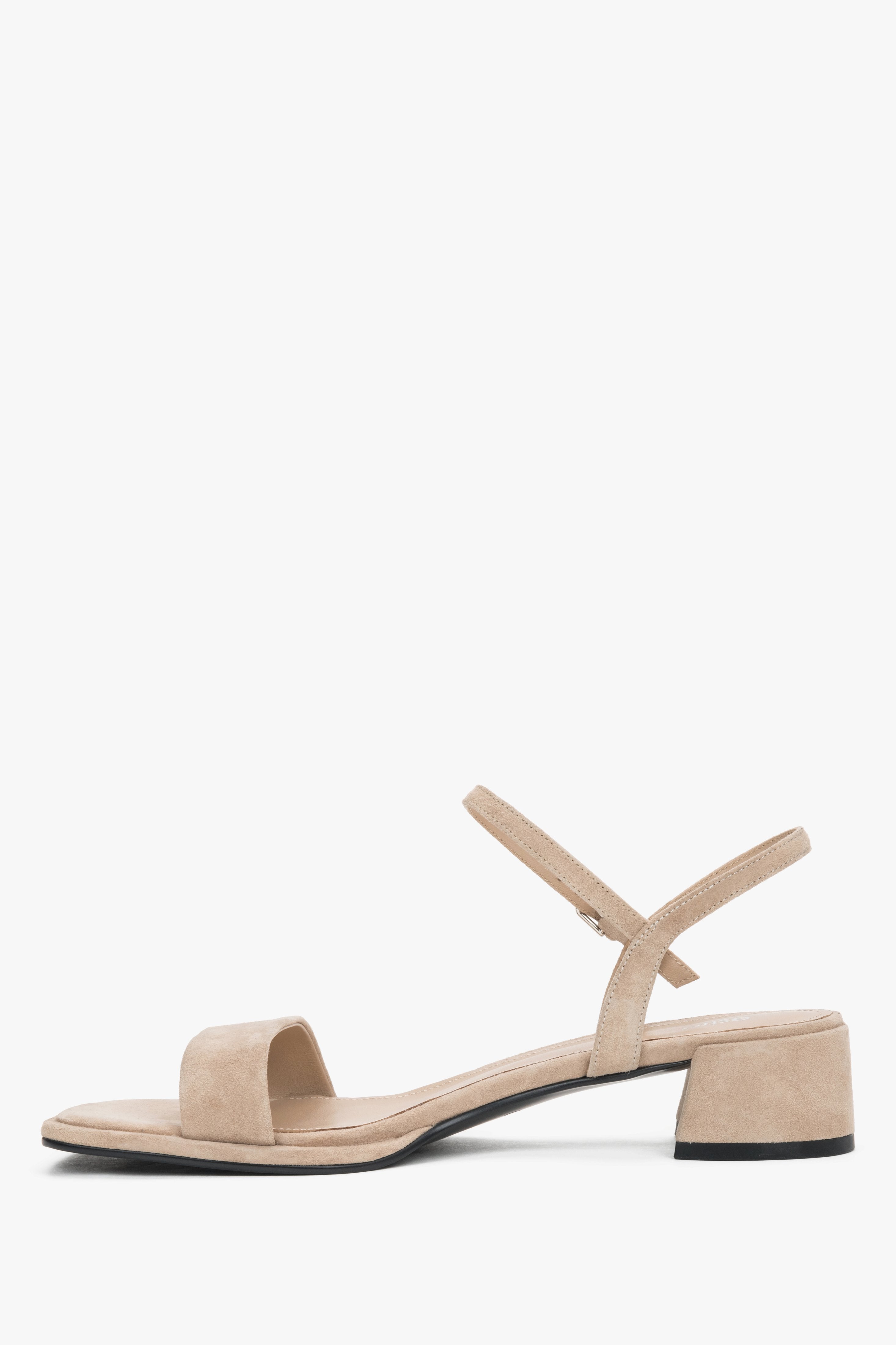 Elegant beige suede sandals with a soft adjustable ankle strap and leather interior.