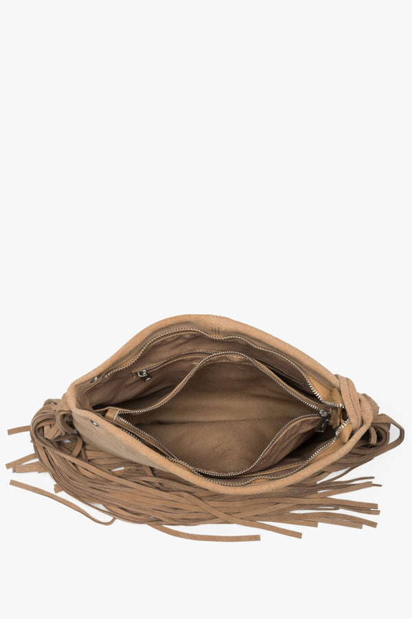 A top-down shot showing the spacious interior with a textile lining, three separate compartments, and smaller pockets.