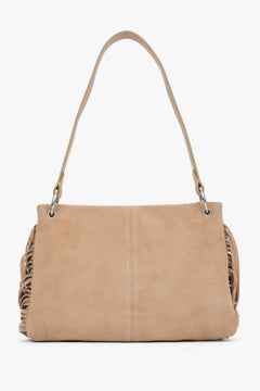 The back of the bag displaying precise, vertical stitching down the center and the light, luxurious texture of the suede material.