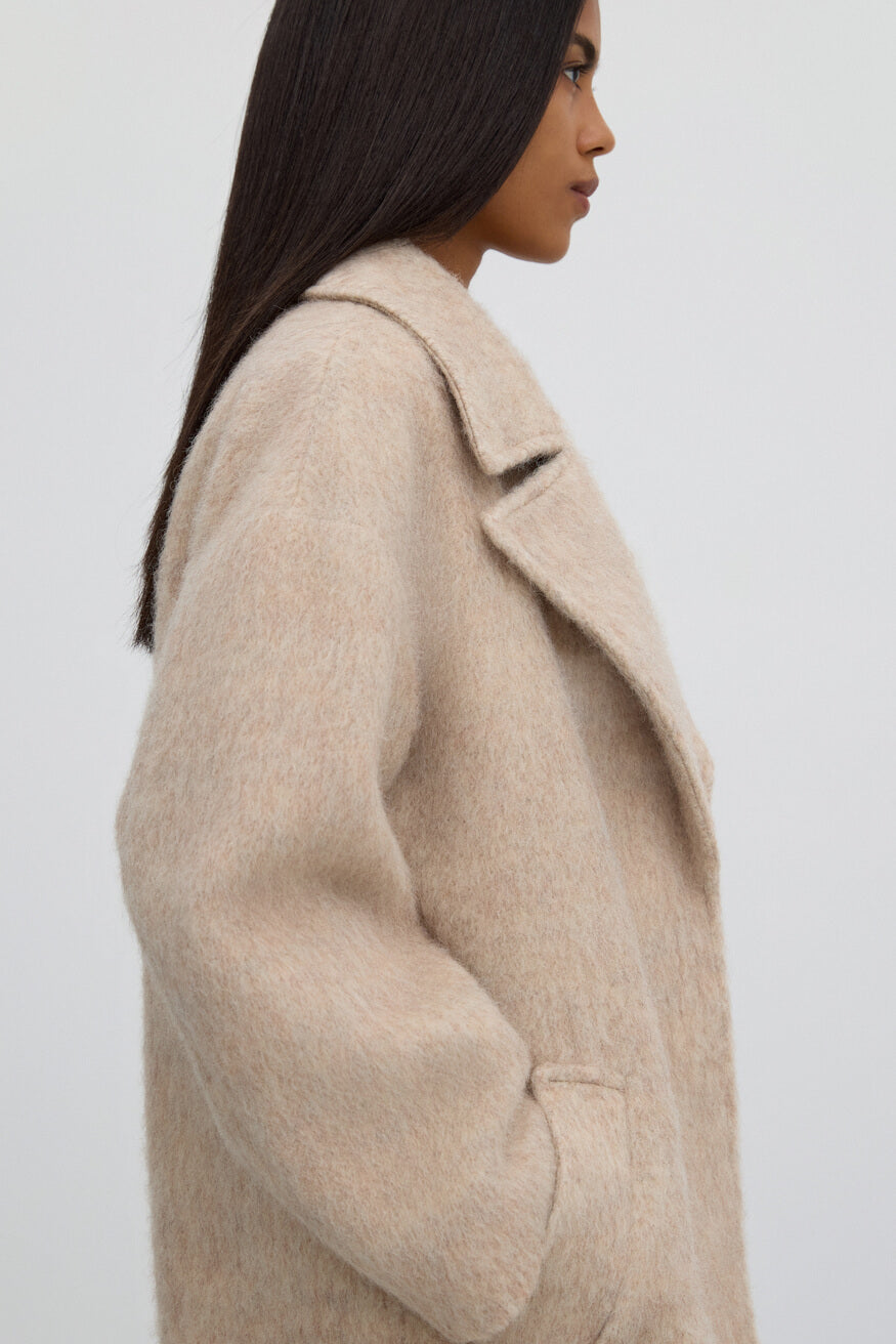 Women's beige wrap trench coat.