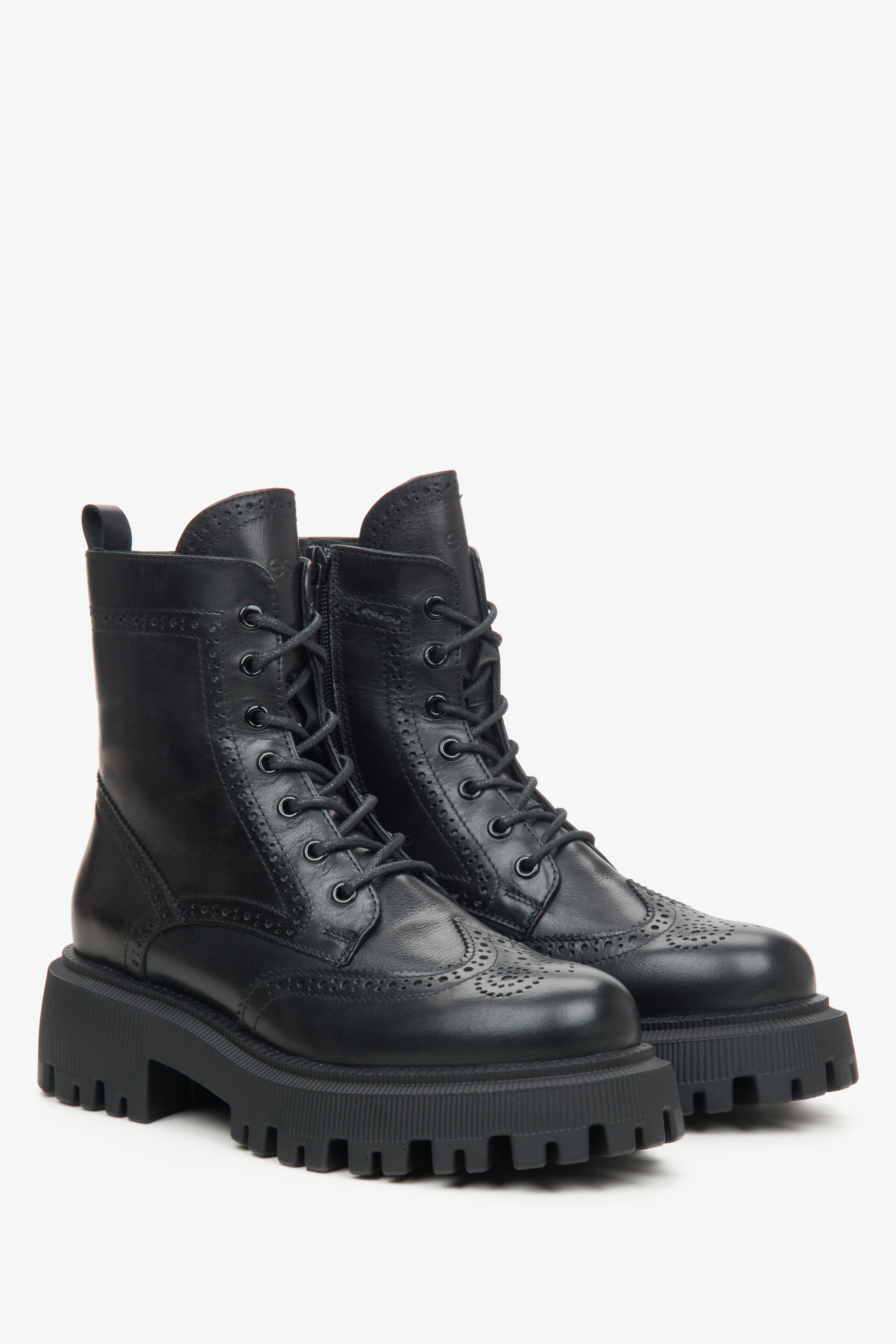 Women's black leather ankle boots with decorative lacing.