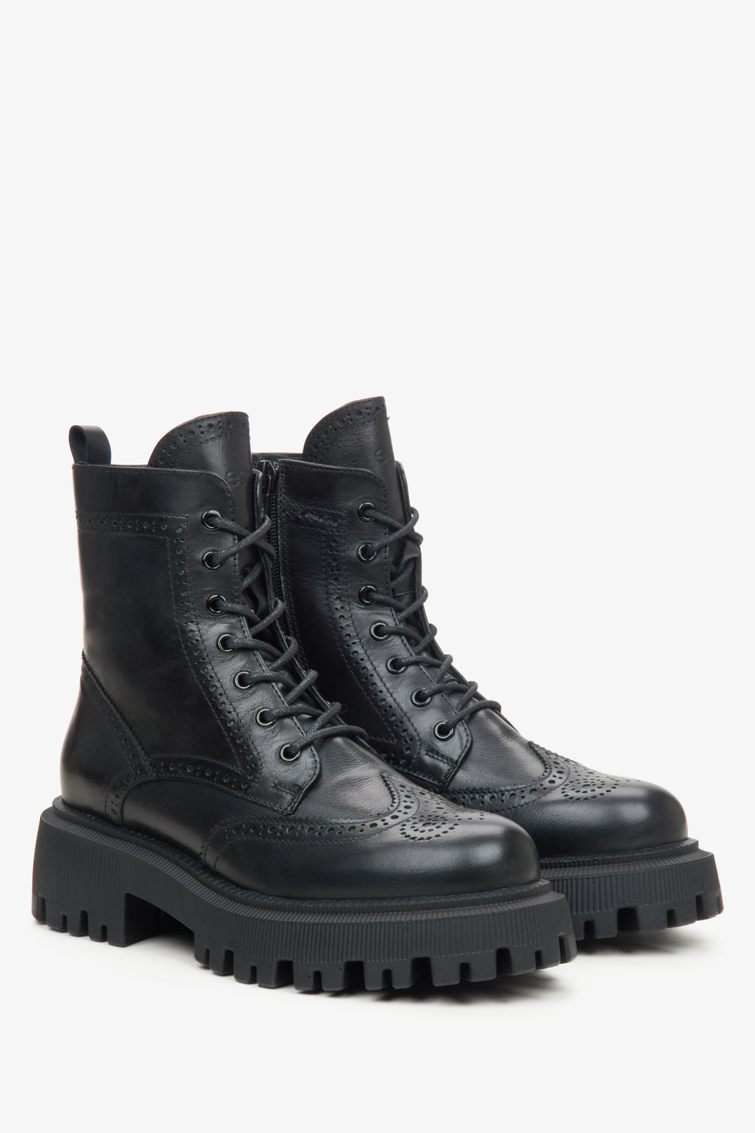 Women's black leather ankle boots with decorative lacing.