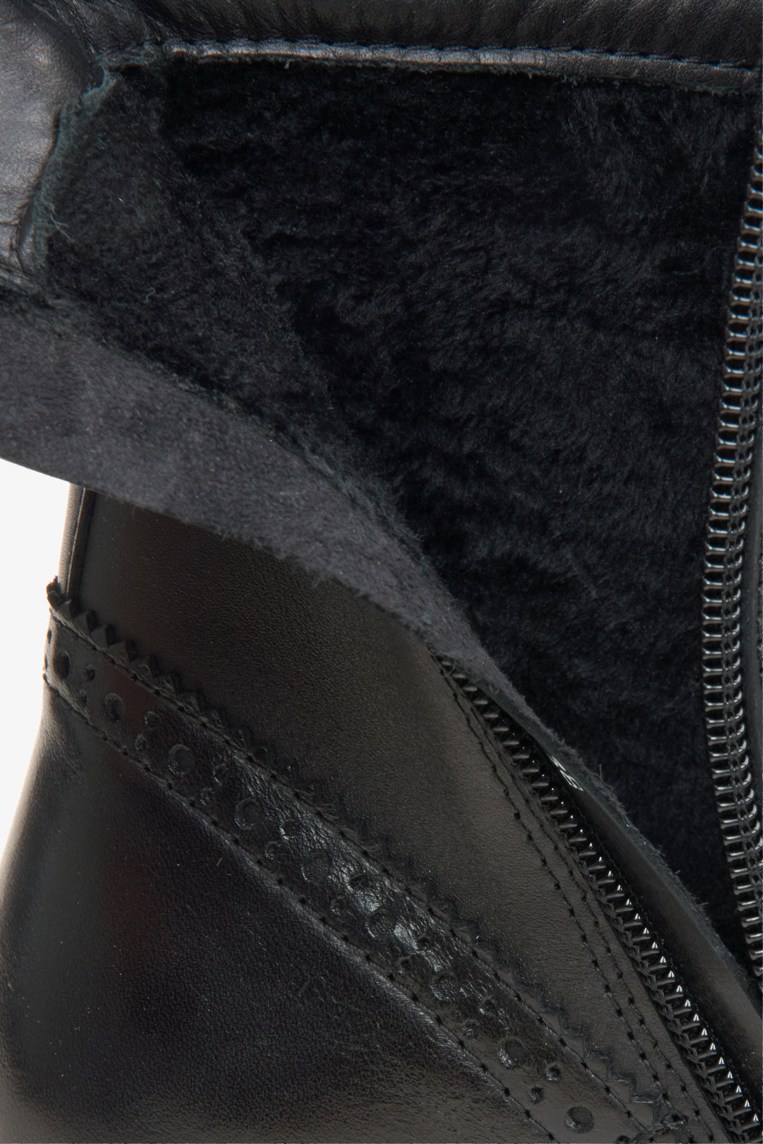 A black leather lace-up ankle boot with a side zipper, decorative brogue detailing, and a chunky lug sole.