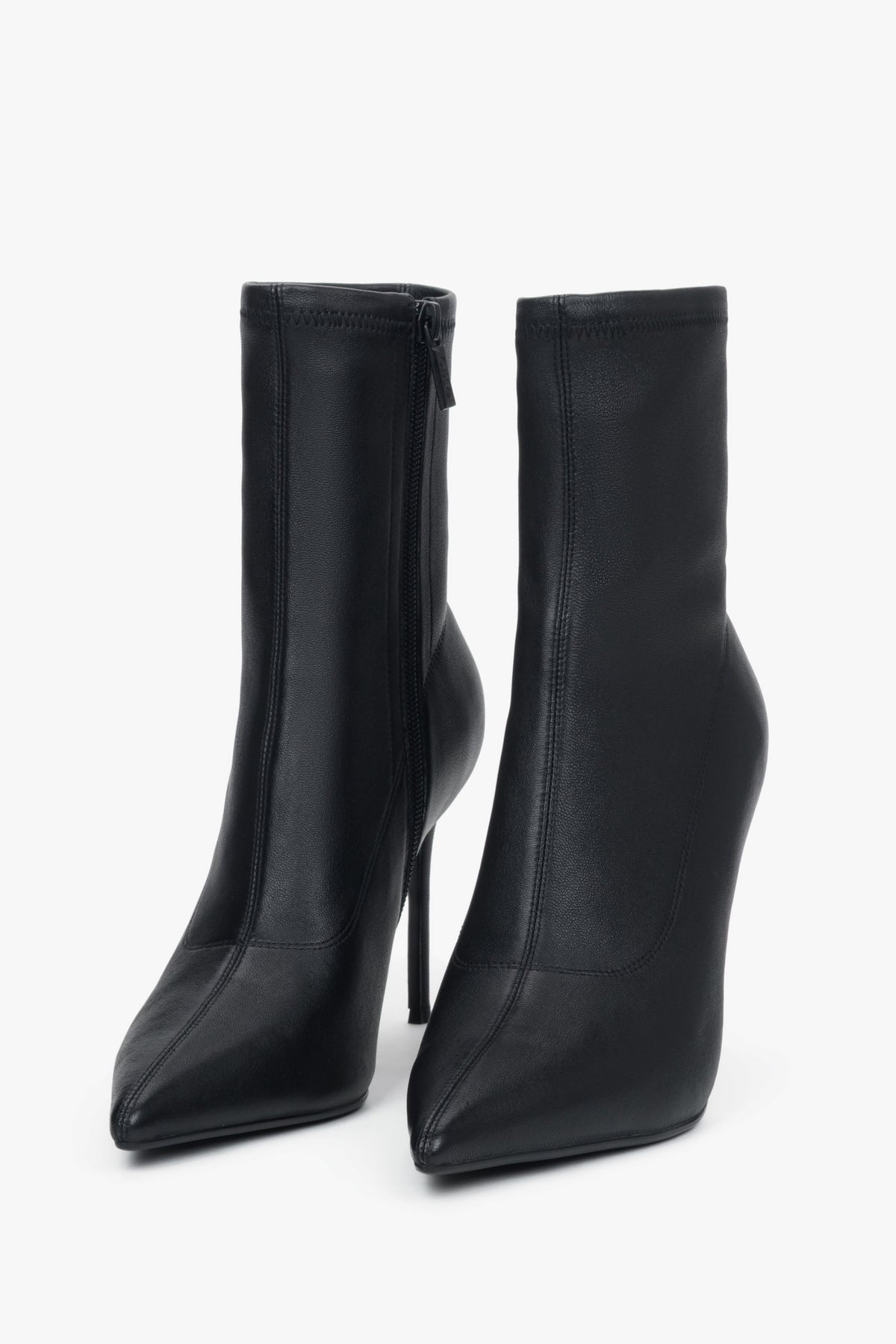 Women’s black ankle boots with an elastic shaft on a high stiletto heel by Estro.