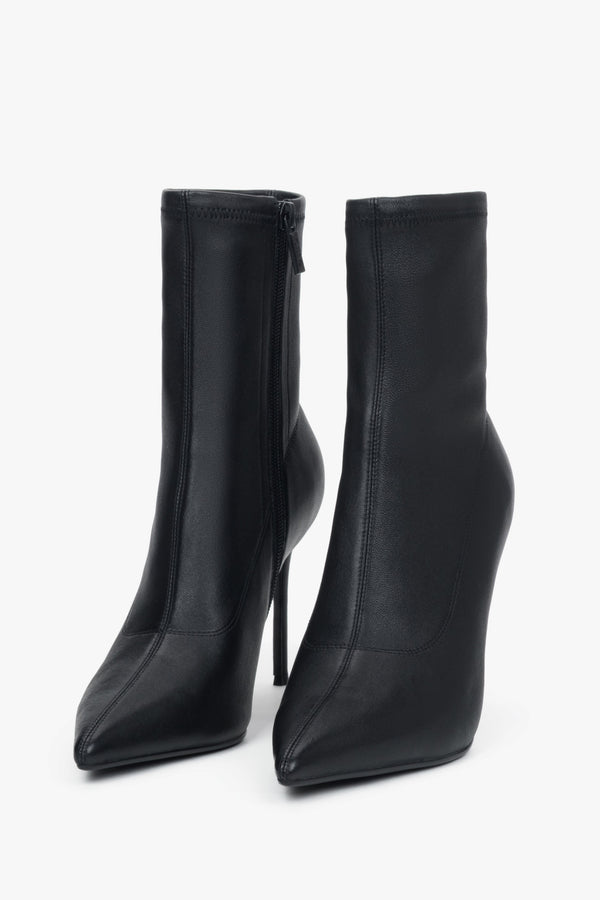 Women’s black ankle boots with an elastic shaft on a high stiletto heel by Estro.