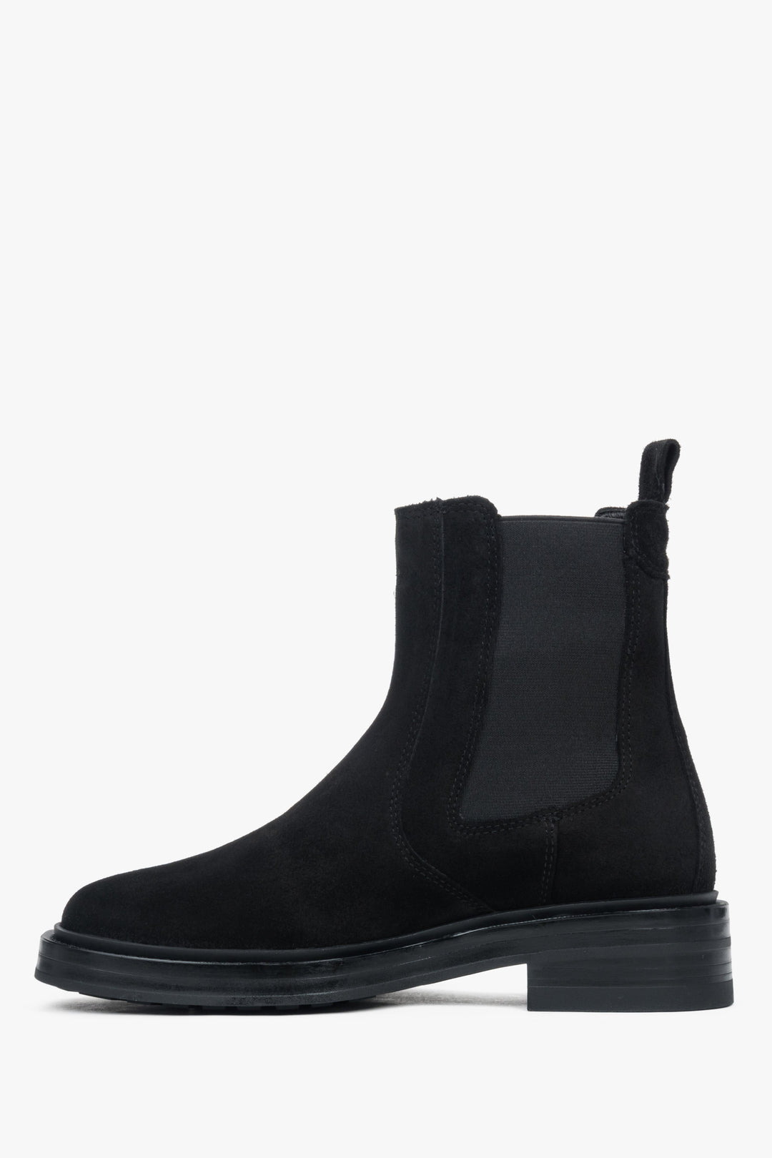 Modern black women’s Chelsea boots with a chunky sole and a high, fitted ankle shaft.