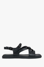 Women’s black flat leather sandals with black details