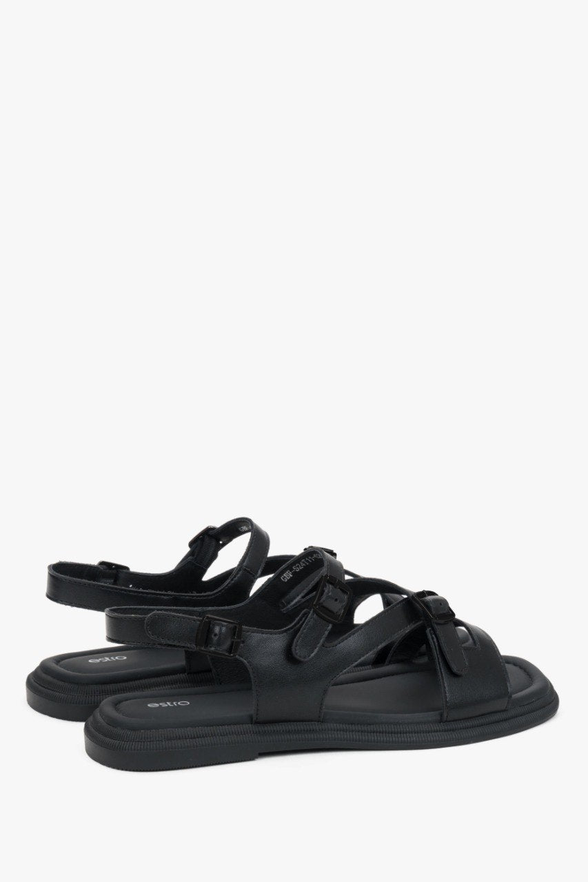 Elegant black flat sandals for women crafted from leather with black detailing