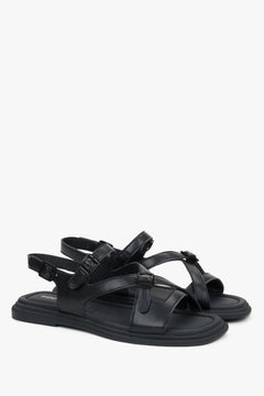 Black leather flat sandals for women with stylish black accents