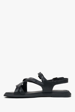Women’s flat black sandals made of genuine leather with black details