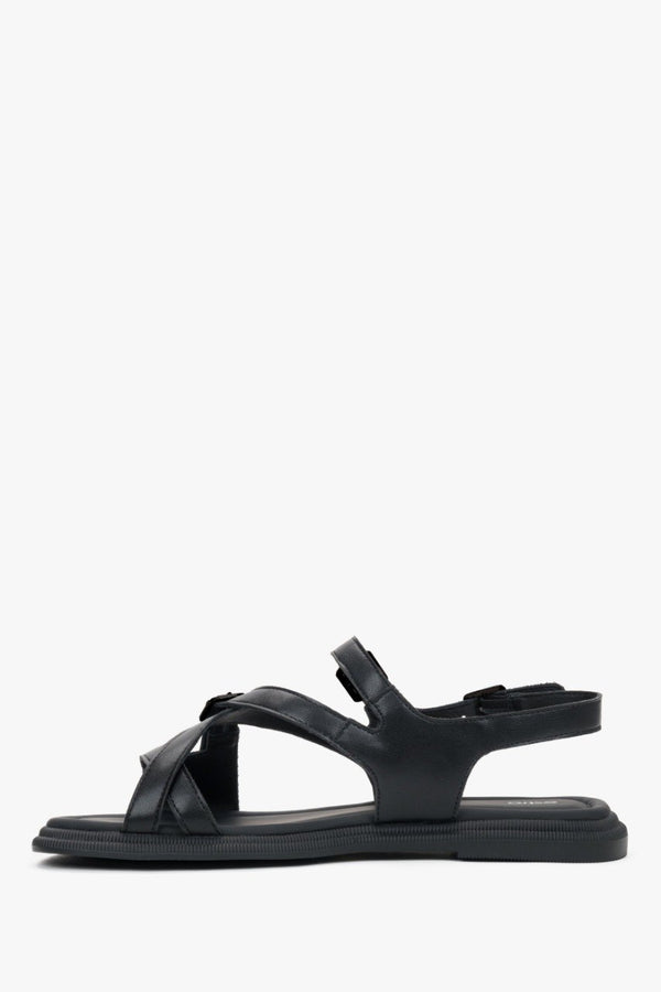 Women’s flat black sandals made of genuine leather with black details