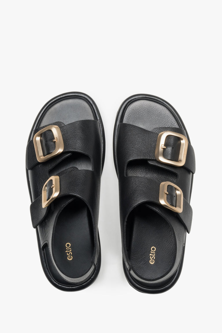 Black women’s flat sandals with adjustable gold-tone buckles, Estro.