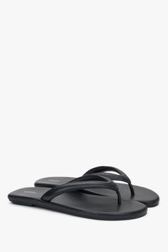 Women’s black flip-flops made from soft genuine leather by Estro.