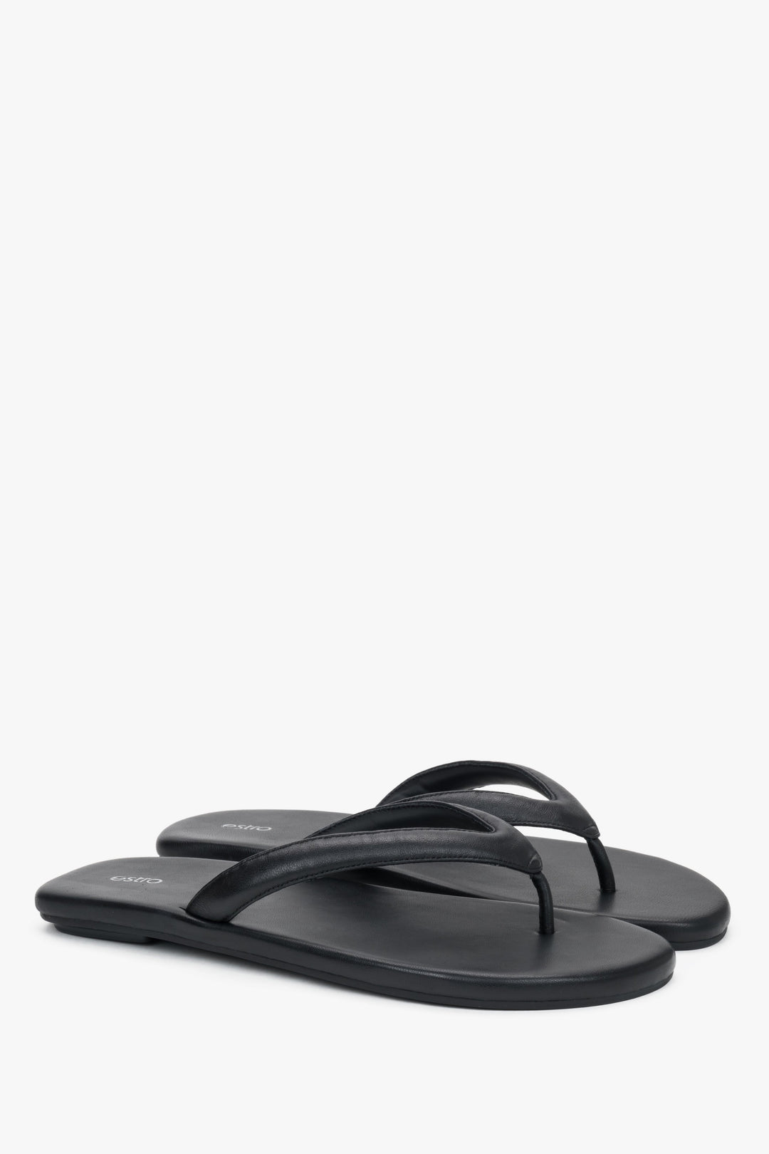 Women’s black flip-flops made from soft genuine leather by Estro.