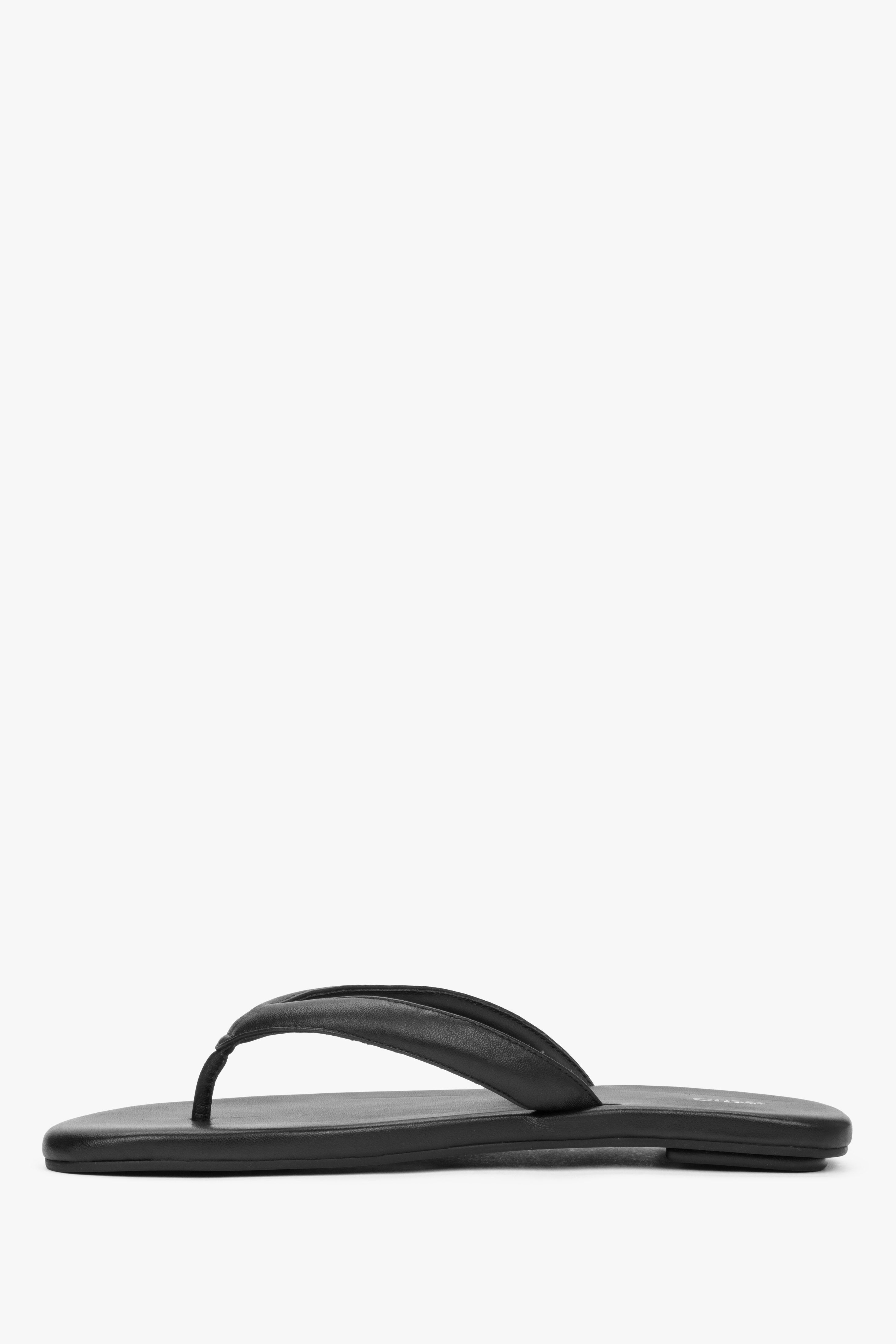 Women’s black flip-flops made from soft natural leather by Estro – side view.