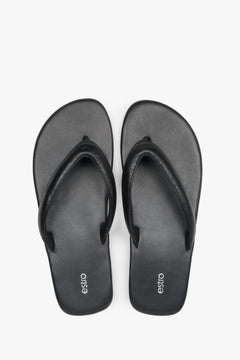 Women’s black flip-flops made from soft genuine leather by Estro – top view.