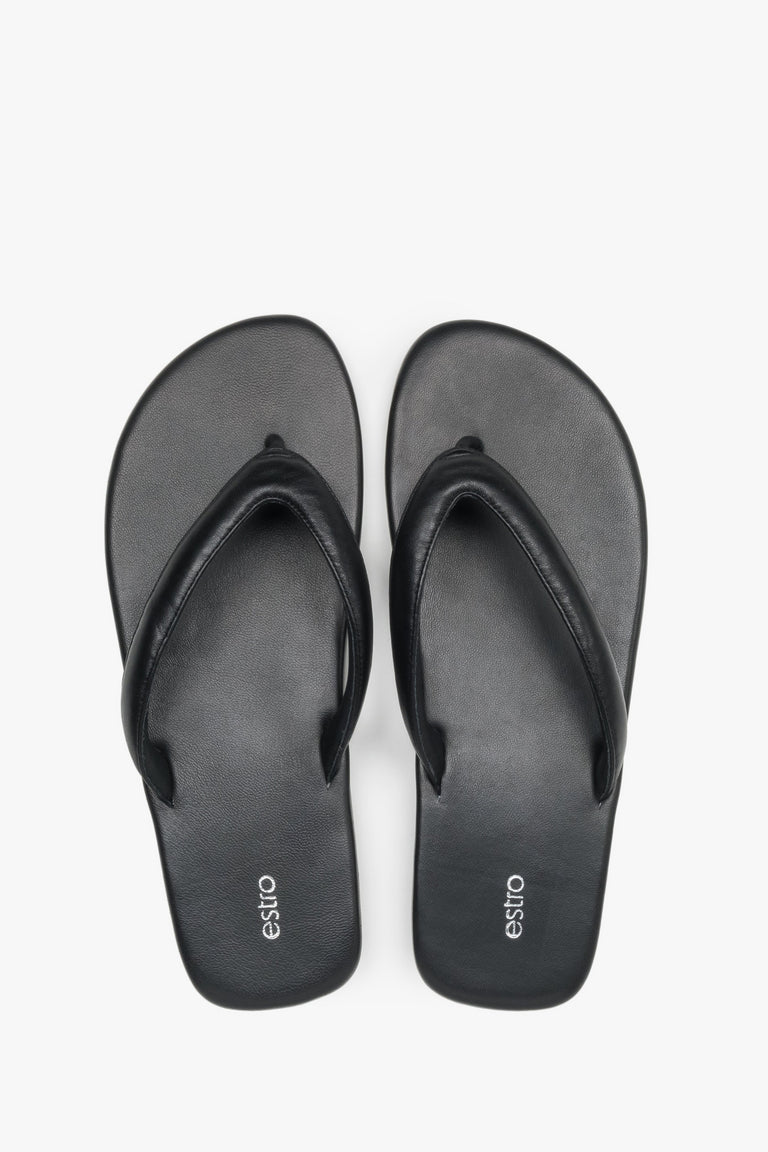 Women’s black flip-flops made from soft genuine leather by Estro – top view.