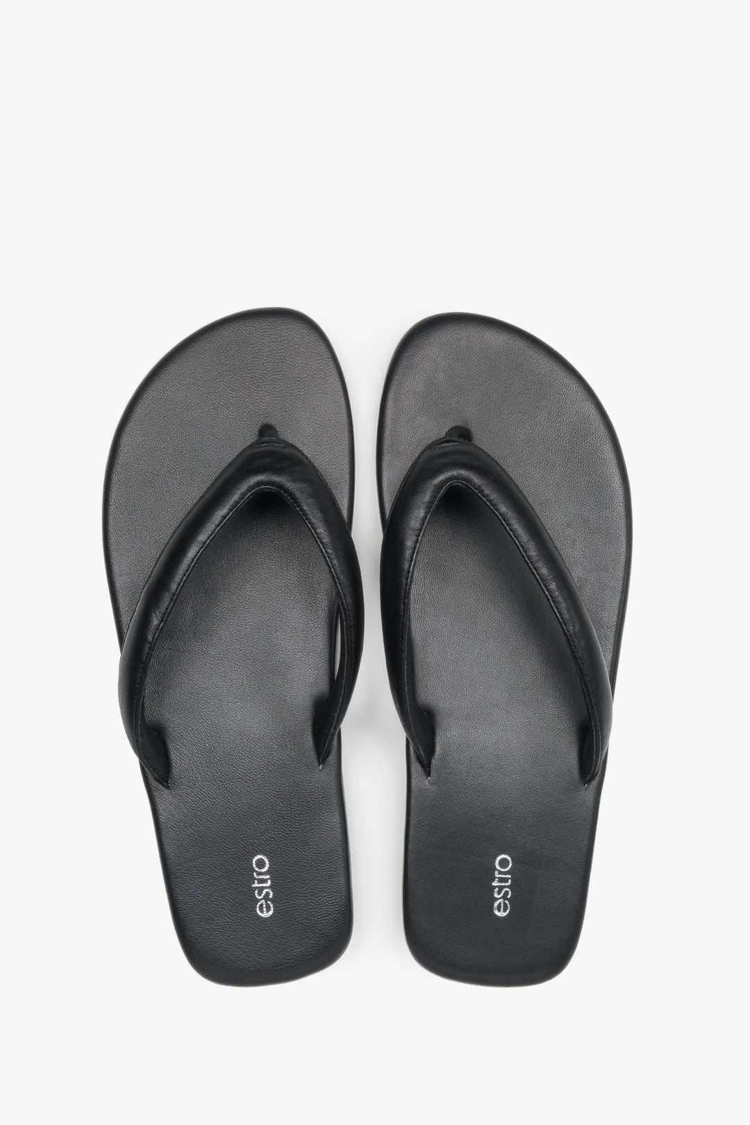 Women’s black flip-flops made from soft genuine leather by Estro – top view.