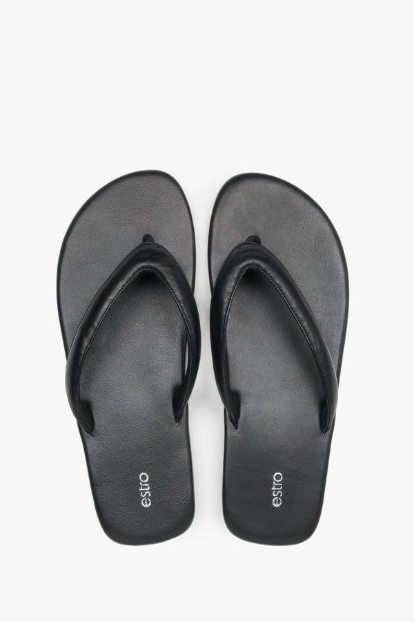 Women’s black flip-flops made from soft genuine leather by Estro – top view.