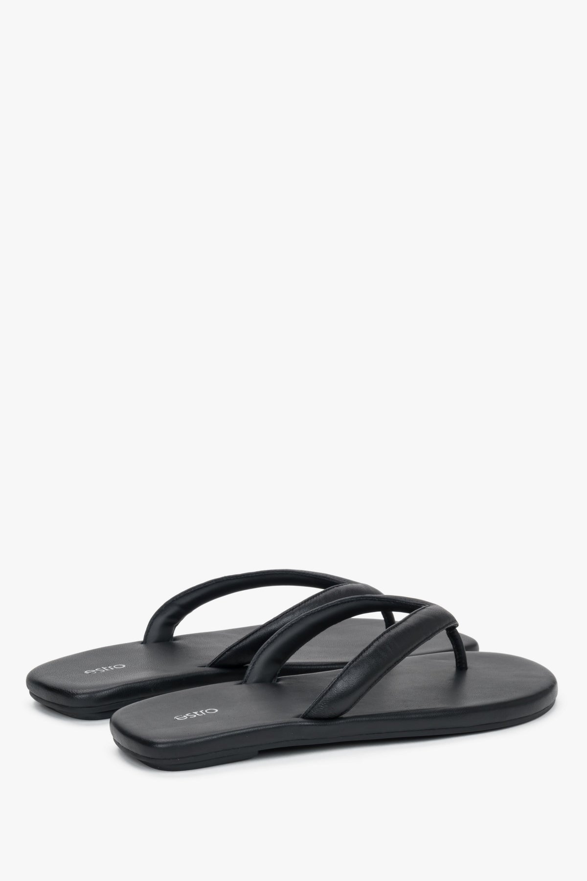 Women’s black flip-flops by Estro made from soft genuine leather – heel view.