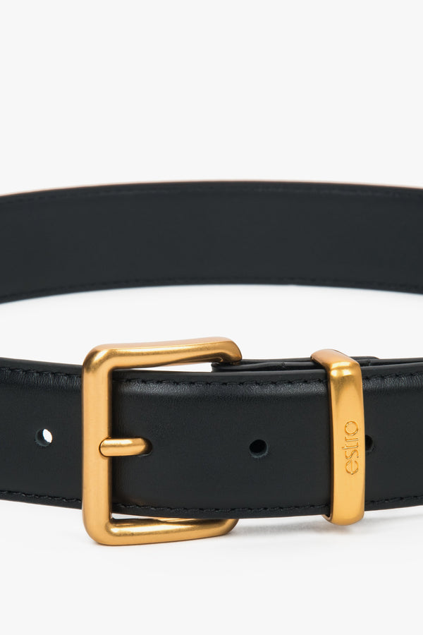 Women's black leather belt with a gold buckle, Estro.