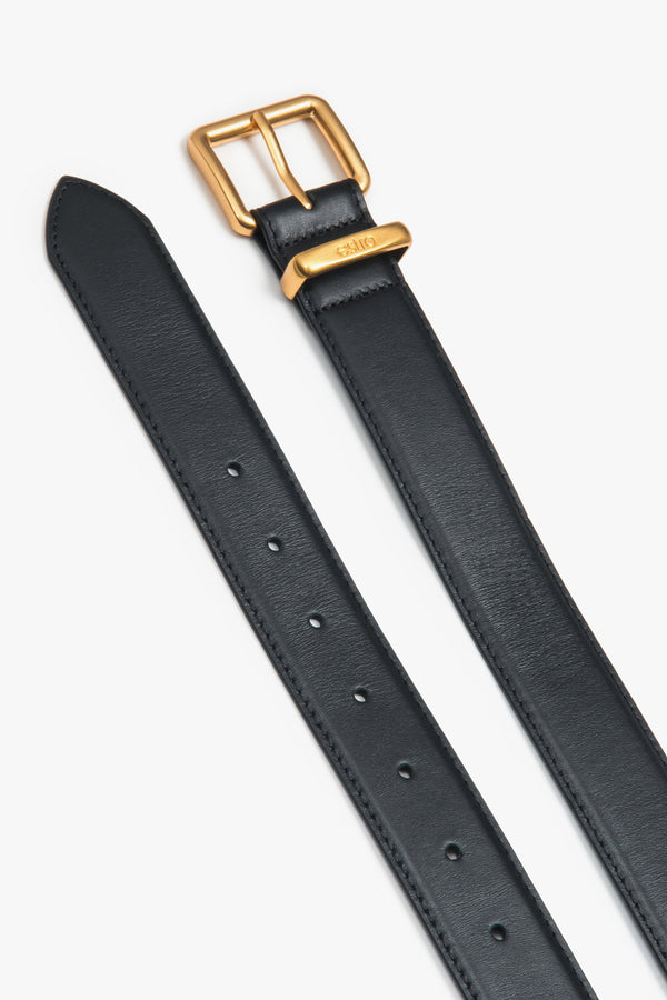 Women's black leather belt with a gold buckle, Estro.