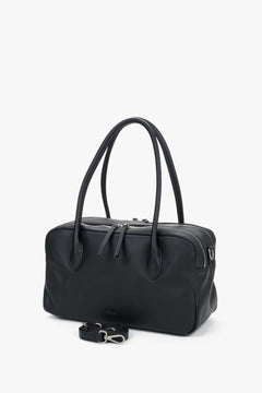 Women's black leather bowling bag Estro - side profile view highlighting its structured silhouette and spacious compartment.