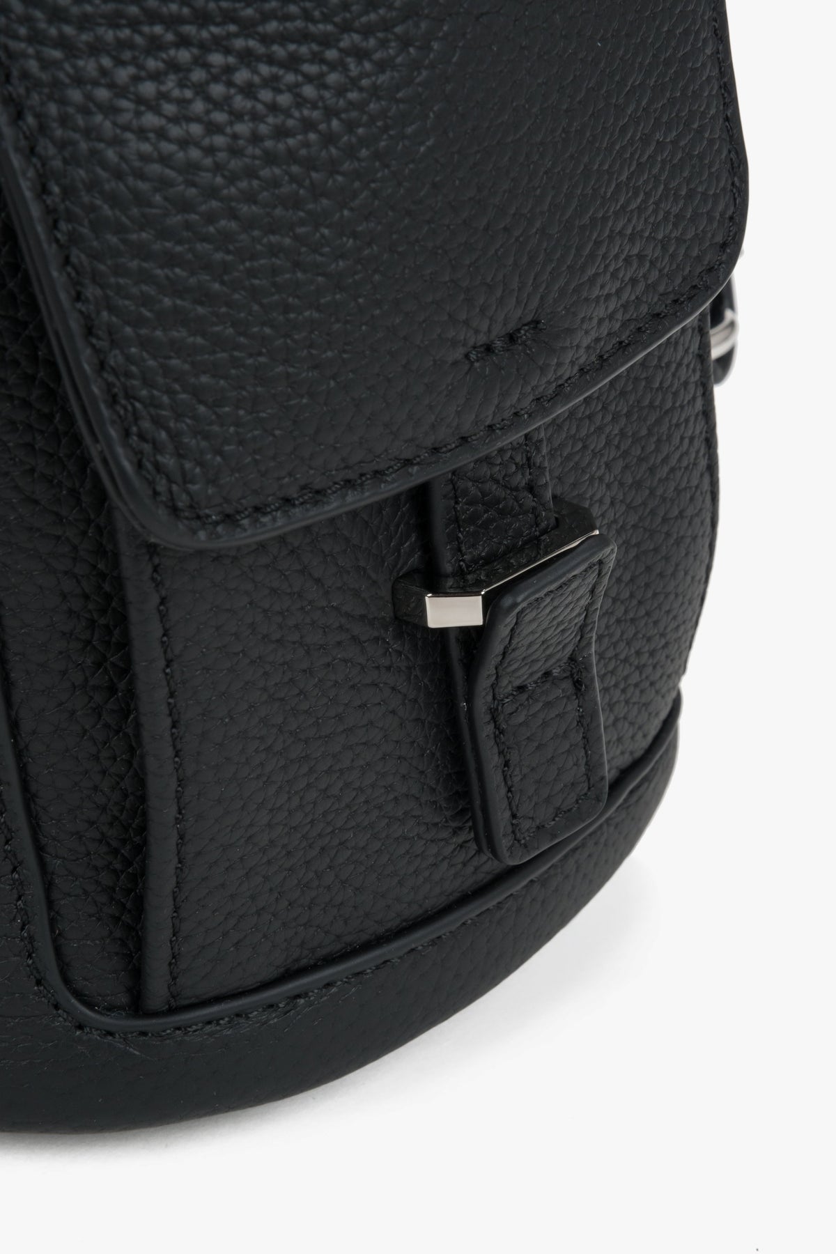 Women's black leather bucket backpack Estro - side view showing shoulder straps and side profile.