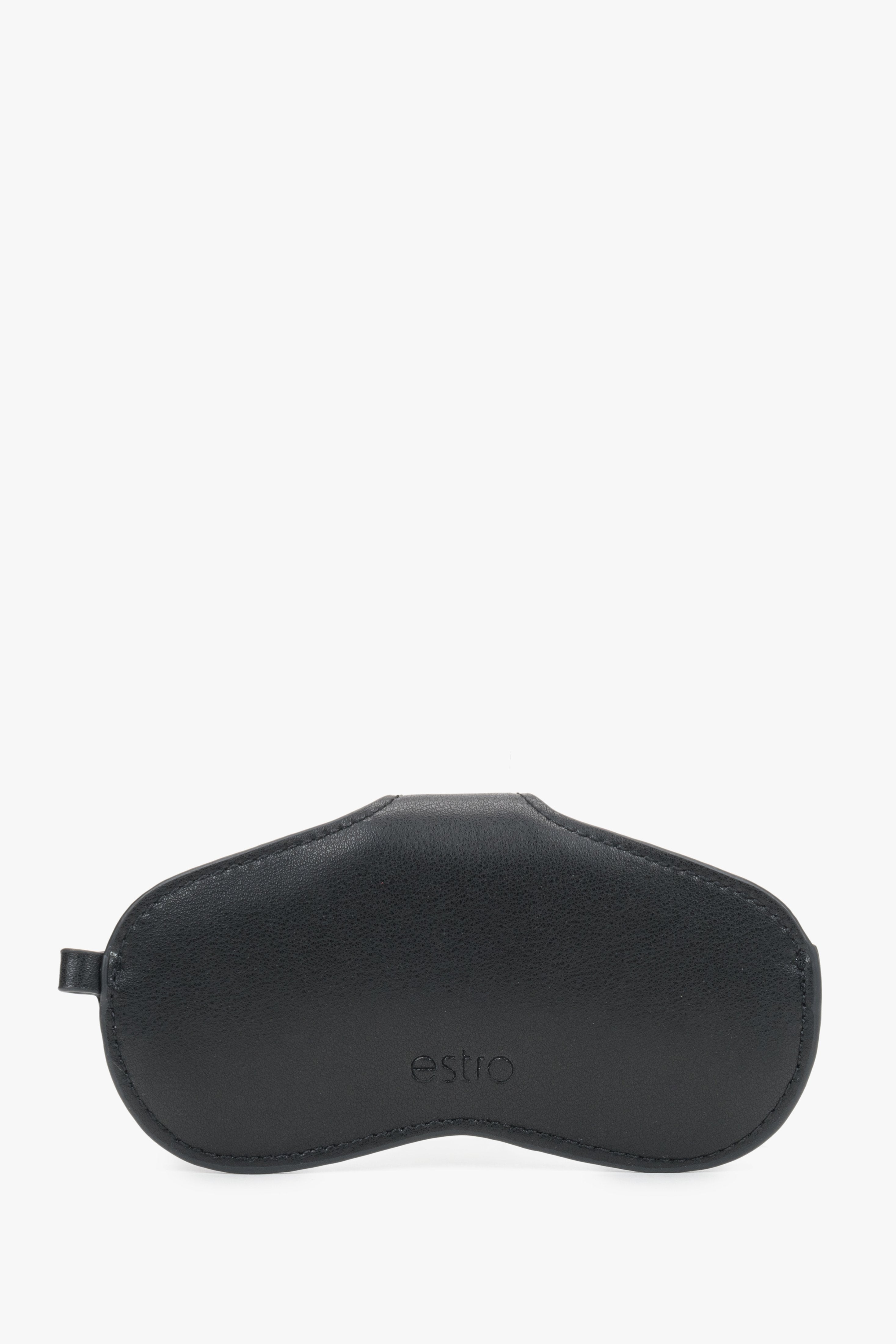 A side view of the black leather case emphasizing its compact, slim profile and precise tonal stitching.