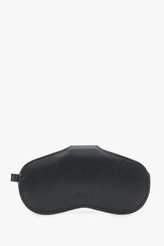 A side view of the black leather case emphasizing its compact, slim profile and precise tonal stitching.