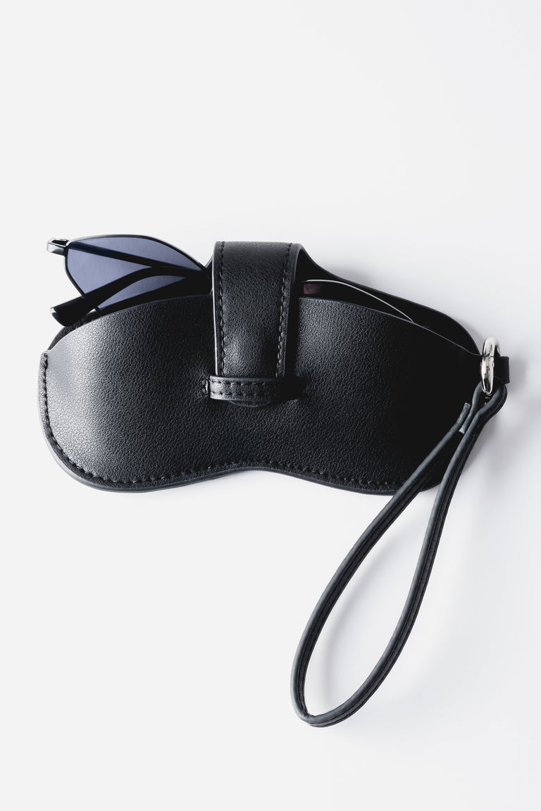 A close-up shot highlighting the adjustable leather strap and the polished finish of the silver-tone metal hardware.