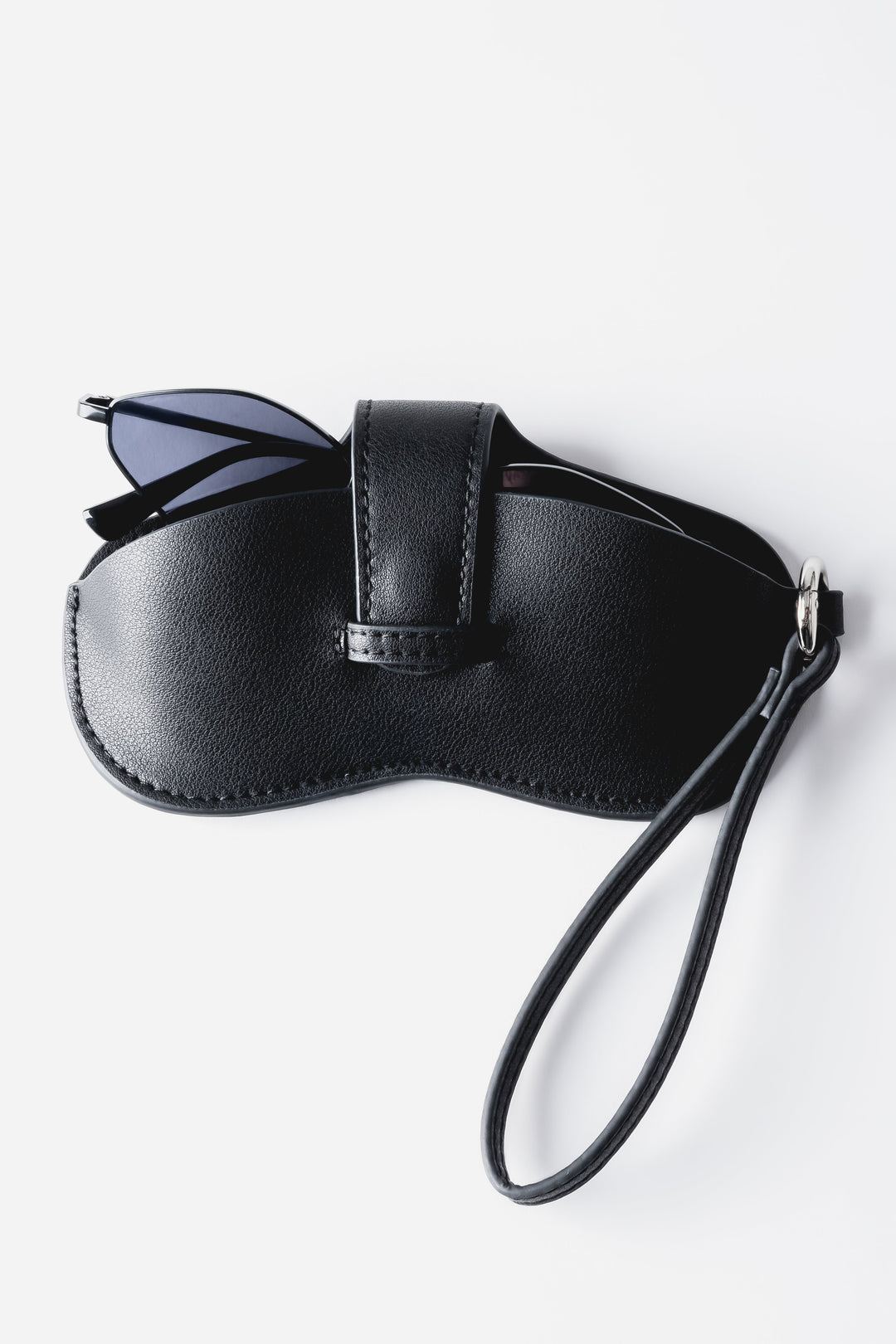 A close-up shot highlighting the adjustable leather strap and the polished finish of the silver-tone metal hardware.
