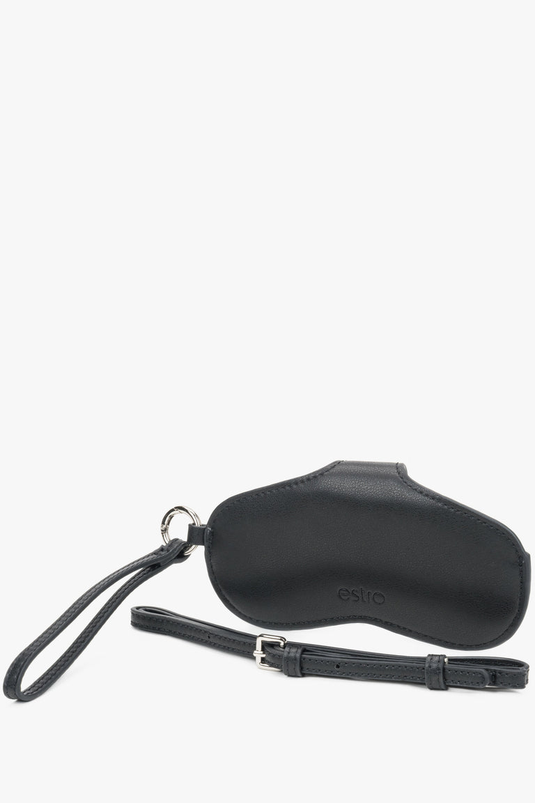The black genuine leather Estro glasses case worn elegantly around the neck, demonstrating its functionality as a modern fashion accessory.