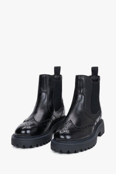 Estro - women's black leather Chelsea boots on a thick sole with brogue perforation.