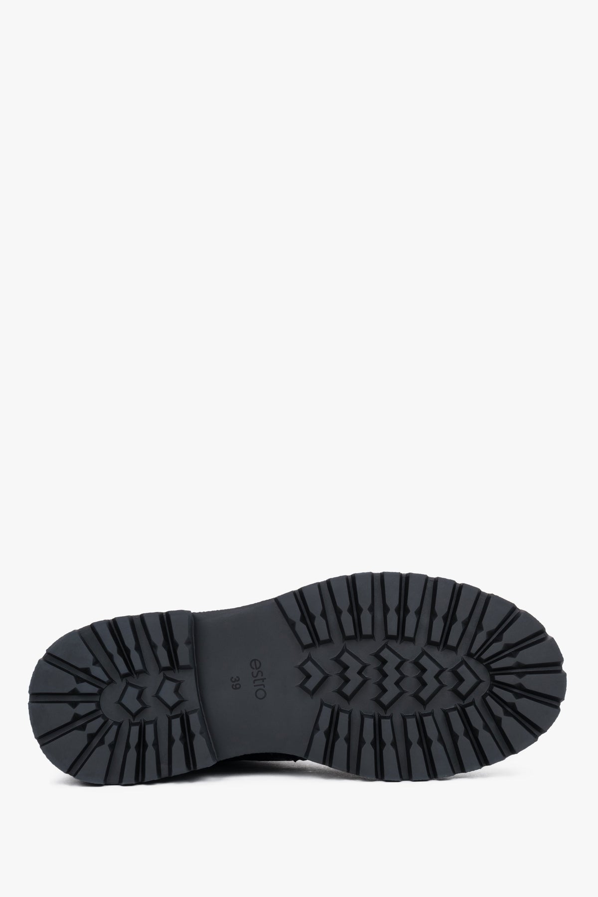 Black leather women's Chelsea boots Estro, on a thick sole, with brogue perforation - close-up of the sole.